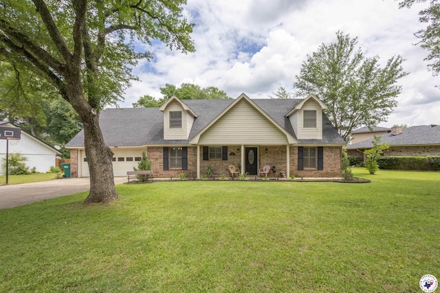 205 S Park Dr, New Boston, TX 75570 - new england style home featuring brick siding, an attached garage, a front yard, driveway, and a porch