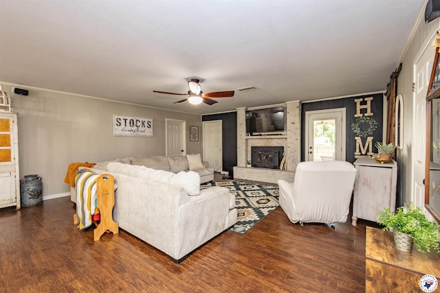 205 S Park Dr, New Boston, TX 75570 - living area featuring wood finished floors, ceiling fan, ornamental molding, and a fireplace