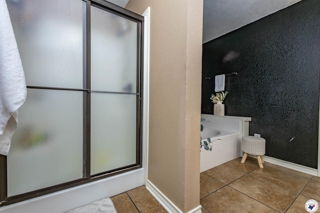 205 S Park Dr, New Boston, TX 75570 - full bath featuring tile patterned flooring, a stall shower, a textured wall, and a bath