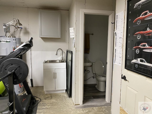 washroom with sink and water heater