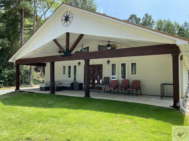 rear view of house featuring a yard, french doors, an outdoor hangout area, ceiling fan, and a patio area