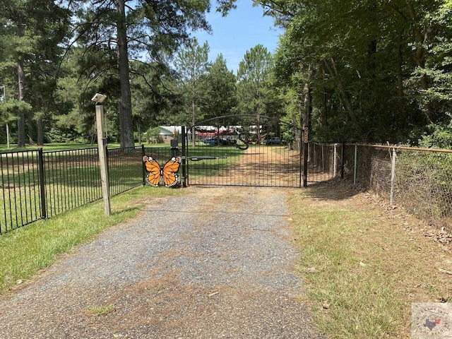 view of gate with fence