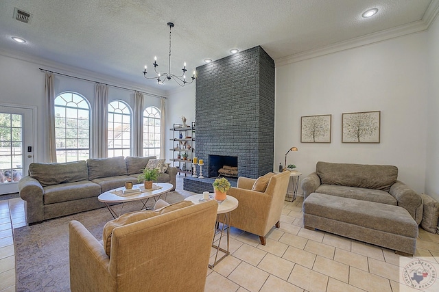 tiled living room with crown molding, an inviting chandelier, a fireplace, and a textured ceiling