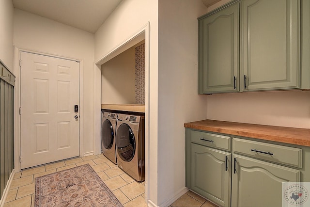 laundry room with washing machine and clothes dryer and light tile patterned flooring