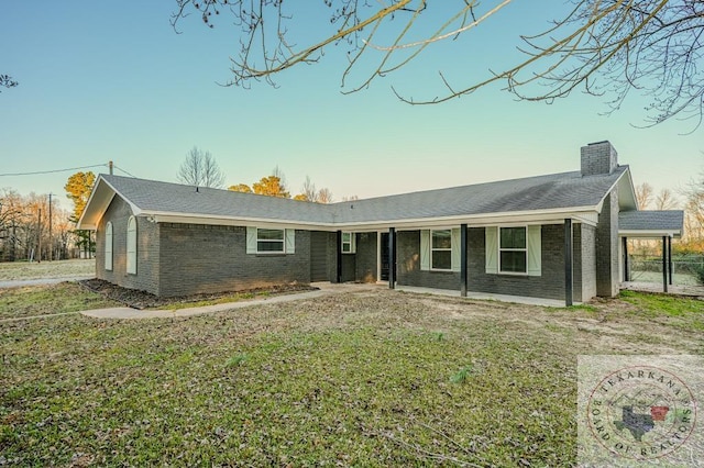 ranch-style home with a front yard