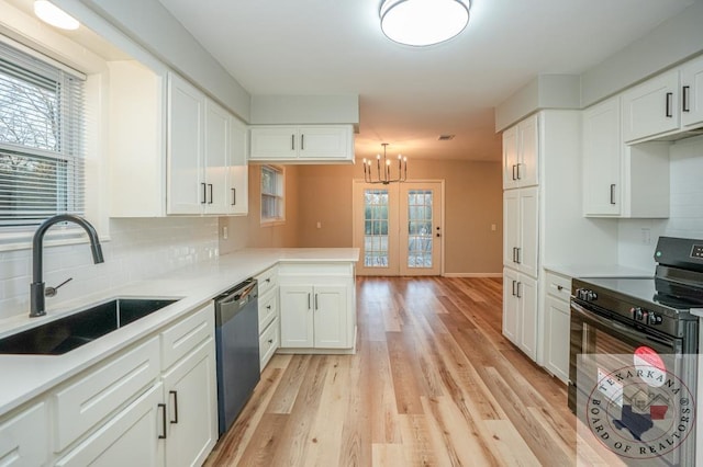 kitchen featuring dishwasher, white cabinetry, tasteful backsplash, sink, and light hardwood / wood-style flooring