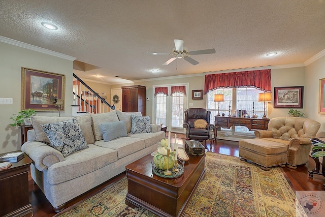 living room with ceiling fan, crown molding, dark hardwood / wood-style floors, and a textured ceiling