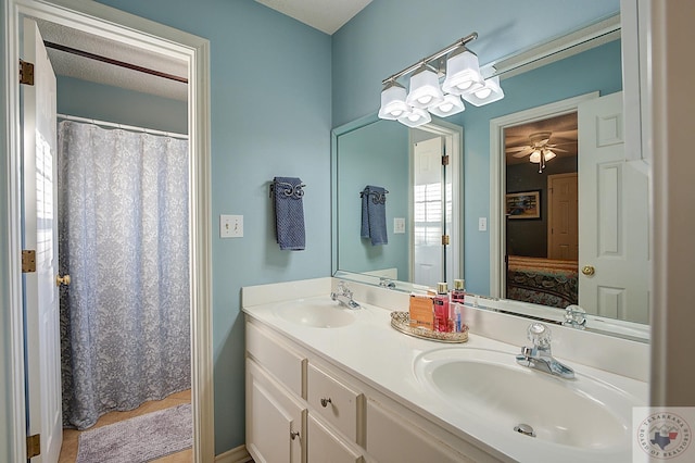 bathroom with vanity and a textured ceiling