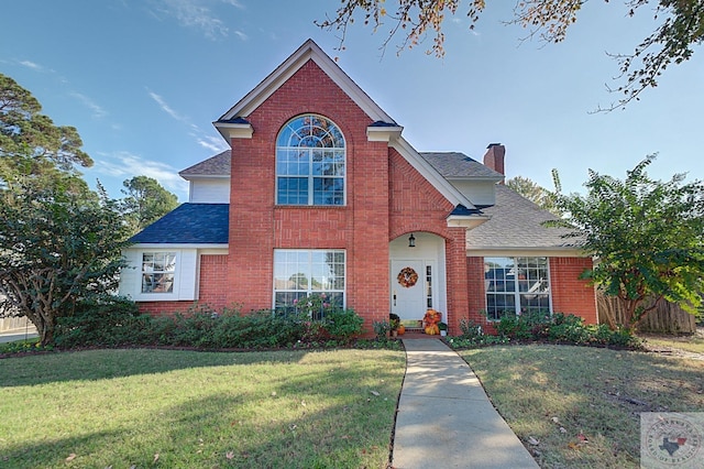 front facade with a front lawn