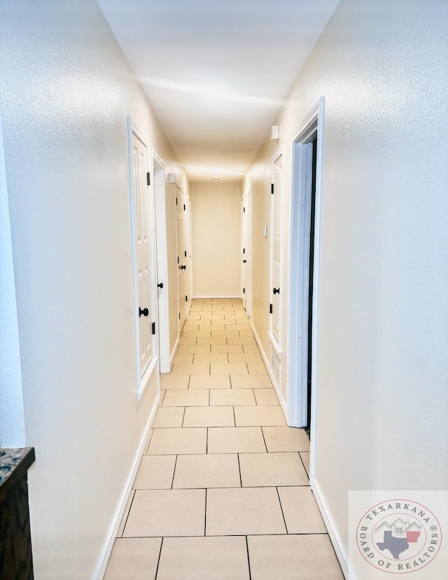 hallway with light tile patterned flooring