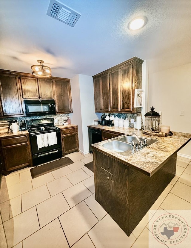 kitchen with kitchen peninsula, dark brown cabinets, sink, light tile patterned flooring, and black appliances