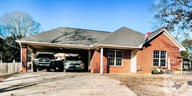 view of front of property featuring a carport