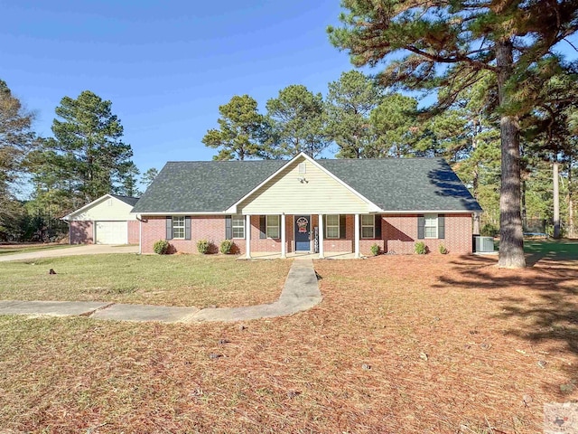 view of front of house with a garage and a front lawn