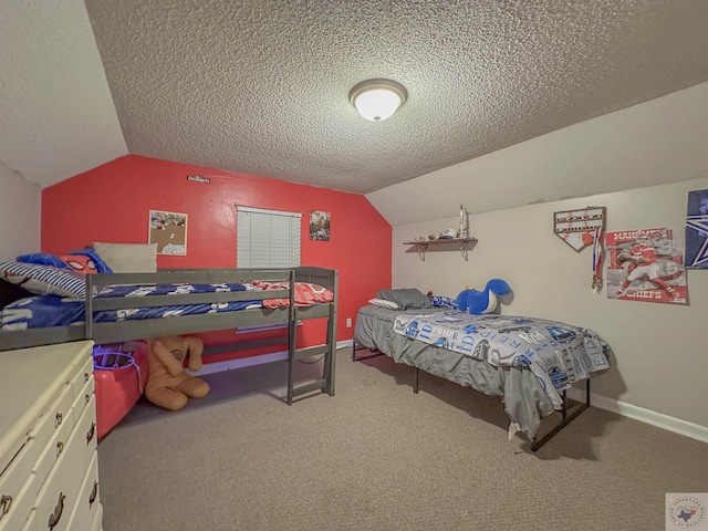 bedroom featuring vaulted ceiling, a textured ceiling, and carpet floors