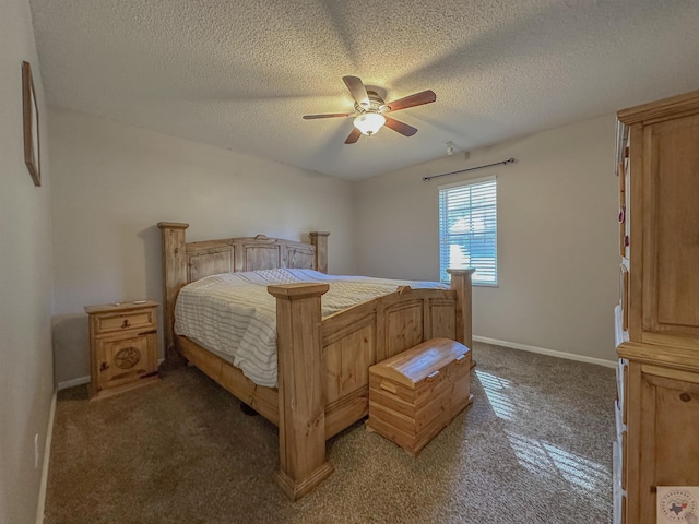 bedroom featuring ceiling fan, dark colored carpet, and a textured ceiling