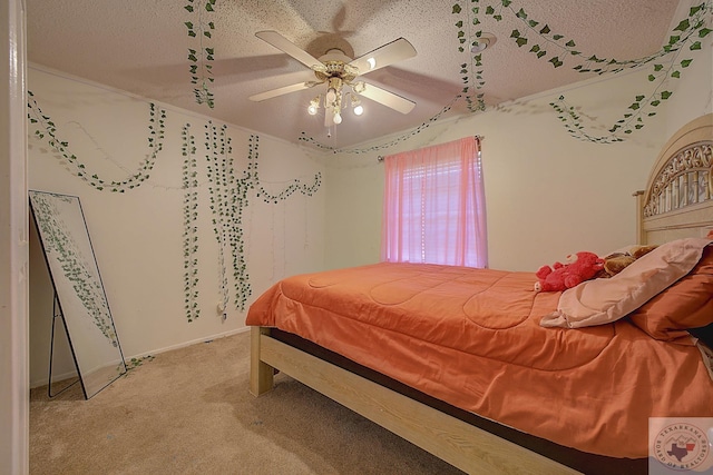 carpeted bedroom with ceiling fan and a textured ceiling