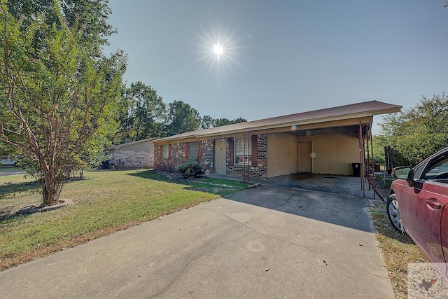 single story home featuring a front yard and a carport