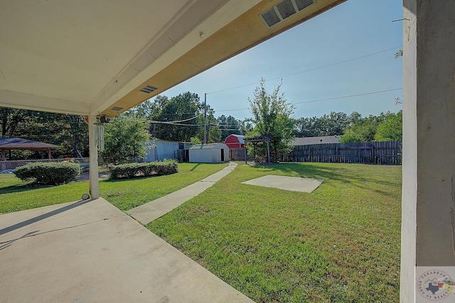 view of yard featuring a storage unit and a gazebo