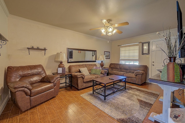 living room featuring crown molding and ceiling fan