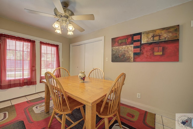 dining space featuring tile patterned floors and ceiling fan