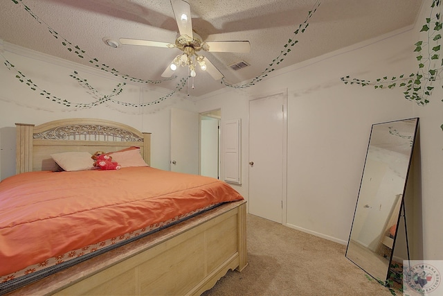 carpeted bedroom with ceiling fan, crown molding, and a textured ceiling