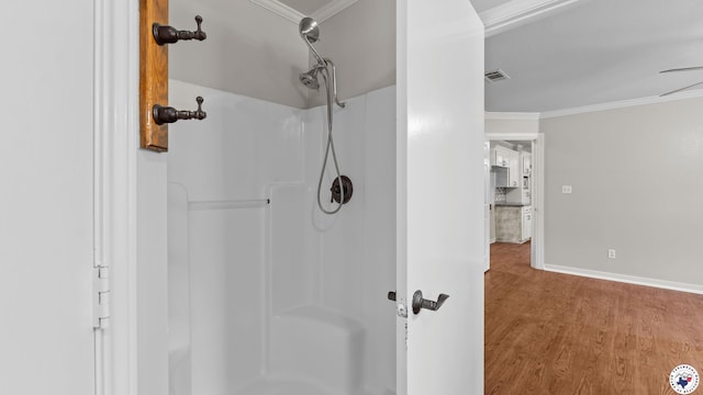 1599 Myrtle Springs Rd, Texarkana, TX 75503 - bathroom featuring a shower, wood finished floors, crown molding, and baseboards