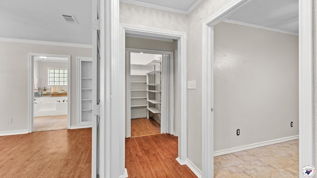 1599 Myrtle Springs Rd, Texarkana, TX 75503 - corridor with ornamental molding, wood finished floors, and baseboards