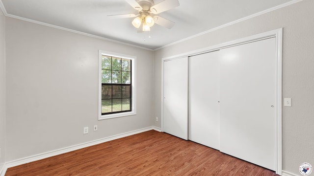 1599 Myrtle Springs Rd, Texarkana, TX 75503 - unfurnished bedroom featuring wood finished floors, crown molding, a closet, a ceiling fan, and baseboards