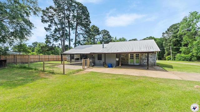 1599 Myrtle Springs Rd, Texarkana, TX 75503 - back of house with french doors, metal roof, and an exterior structure