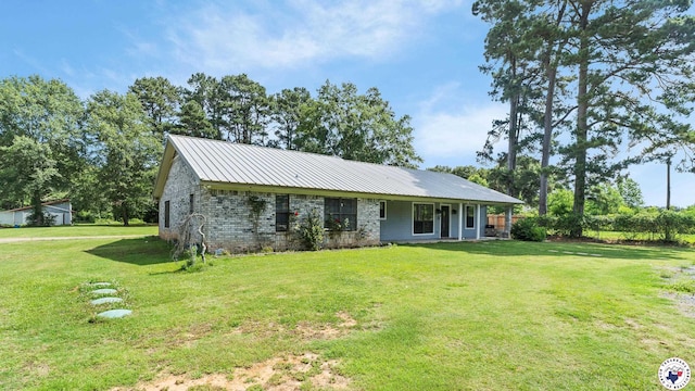 1599 Myrtle Springs Rd, Texarkana, TX 75503 - view of front facade featuring a front yard and metal roof