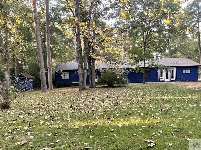 view of yard featuring french doors