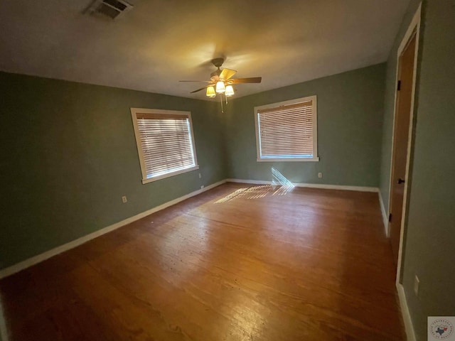 spare room with ceiling fan and hardwood / wood-style floors