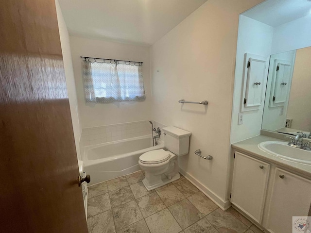 bathroom featuring a bath, toilet, and vanity