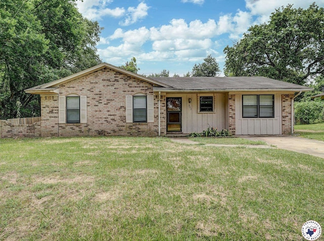 903 Mimosa St, Wake Village, TX 75501 - ranch-style home with a front yard, brick siding, and board and batten siding