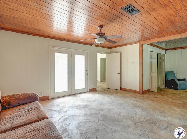 903 Mimosa St, Wake Village, TX 75501 - unfurnished living room featuring wooden ceiling, ceiling fan, wood walls, concrete flooring, and ornamental molding