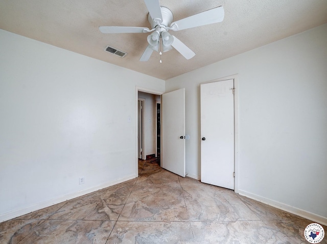 903 Mimosa St, Wake Village, TX 75501 - unfurnished bedroom with ceiling fan and a textured ceiling