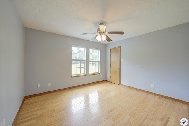 1121 Kelly Rd, Texarkana, TX 75501 - spare room with a ceiling fan, light wood finished floors, and baseboards