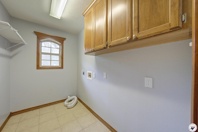 1121 Kelly Rd, Texarkana, TX 75501 - laundry room featuring baseboards, electric dryer hookup, cabinet space, and washer hookup
