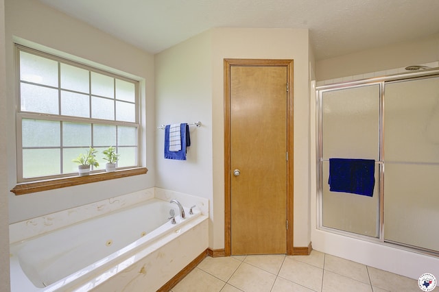 1121 Kelly Rd, Texarkana, TX 75501 - full bath with a shower stall, a jetted tub, tile patterned floors, and baseboards
