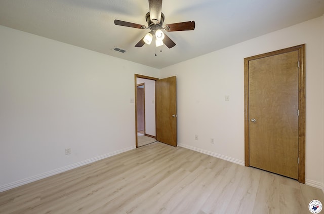 1121 Kelly Rd, Texarkana, TX 75501 - unfurnished bedroom featuring light wood-style flooring, baseboards, and a ceiling fan