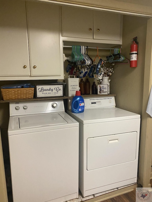 laundry area with laundry area, dark wood-style floors, and washer and clothes dryer