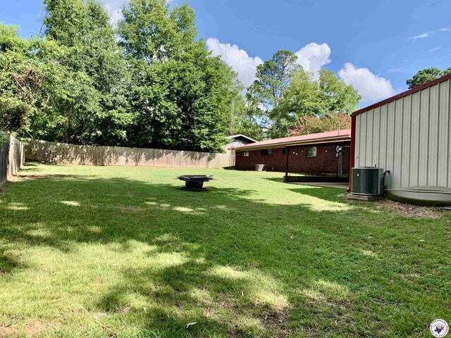 308 Eleanor St, Atlanta, TX 75551 - view of yard featuring an outdoor fire pit