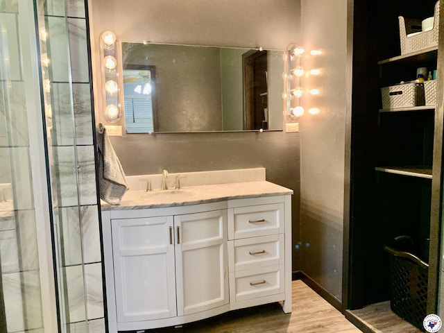 308 Eleanor St, Atlanta, TX 75551 - bathroom with vanity and wood finished floors