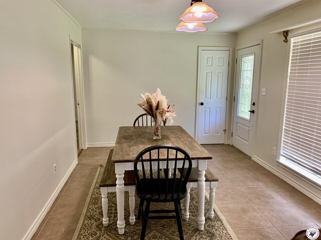 308 Eleanor St, Atlanta, TX 75551 - dining space with tile patterned floors and ornamental molding
