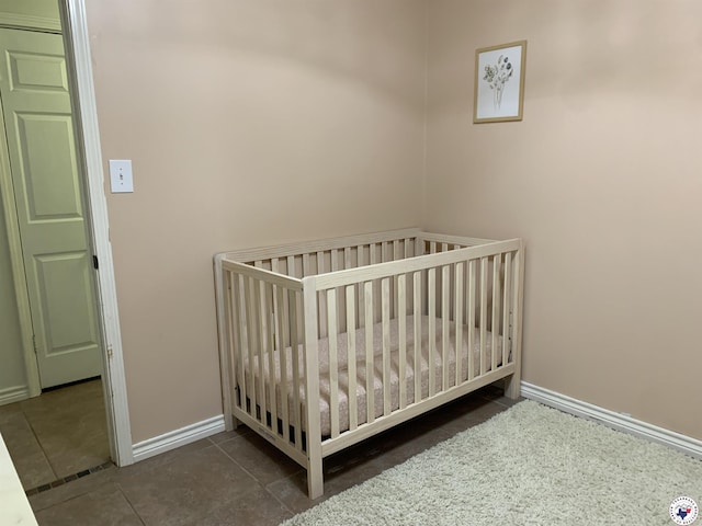 308 Eleanor St, Atlanta, TX 75551 - tiled bedroom featuring baseboards
