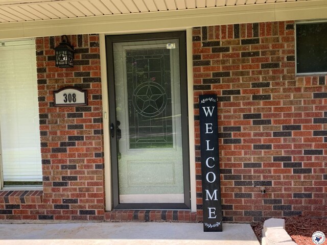308 Eleanor St, Atlanta, TX 75551 - property entrance with brick siding