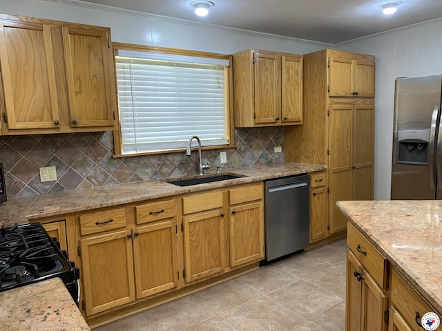 308 Eleanor St, Atlanta, TX 75551 - kitchen with appliances with stainless steel finishes, ornamental molding, backsplash, light tile patterned flooring, and light stone countertops