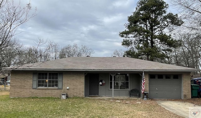 ranch-style house with a garage and a front lawn