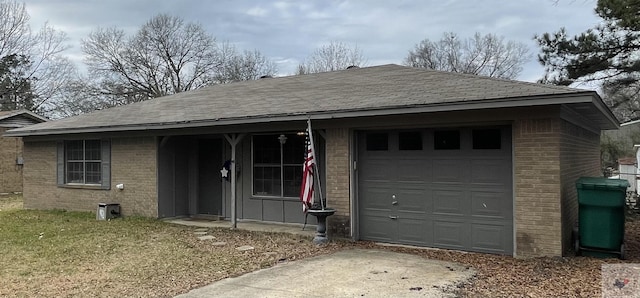 ranch-style home with a garage and a front yard