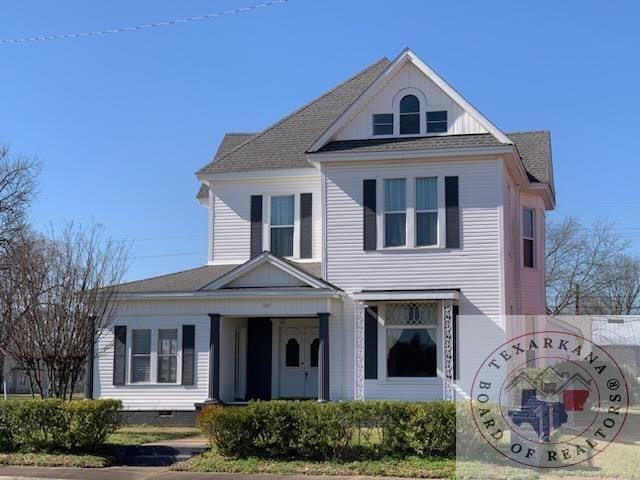 view of front of home featuring crawl space and roof with shingles